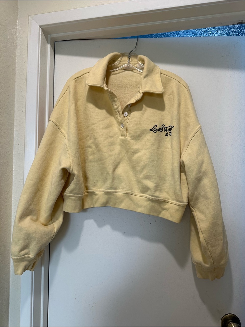 Levi's Cropped Polo Sweatshirt in Pale Yellow
